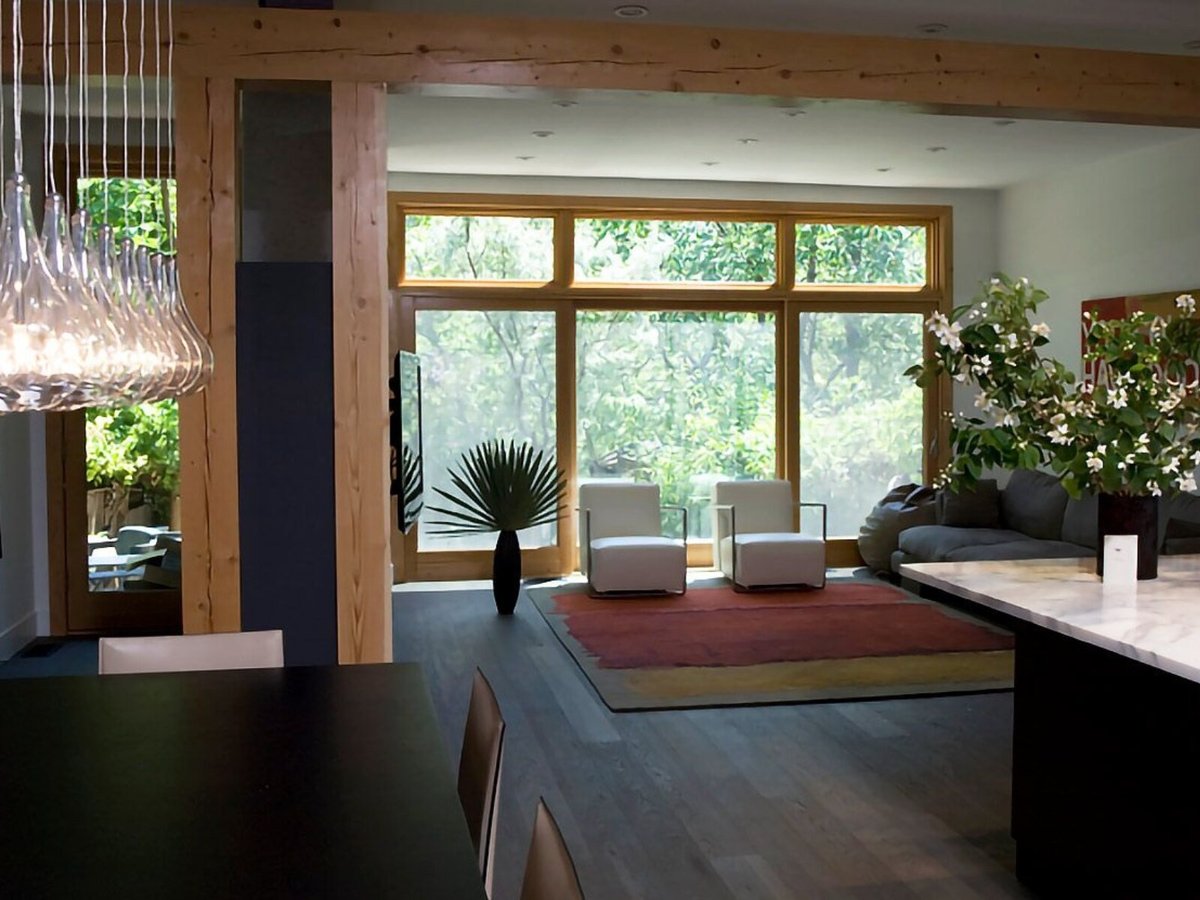 living room with windows and wood accents