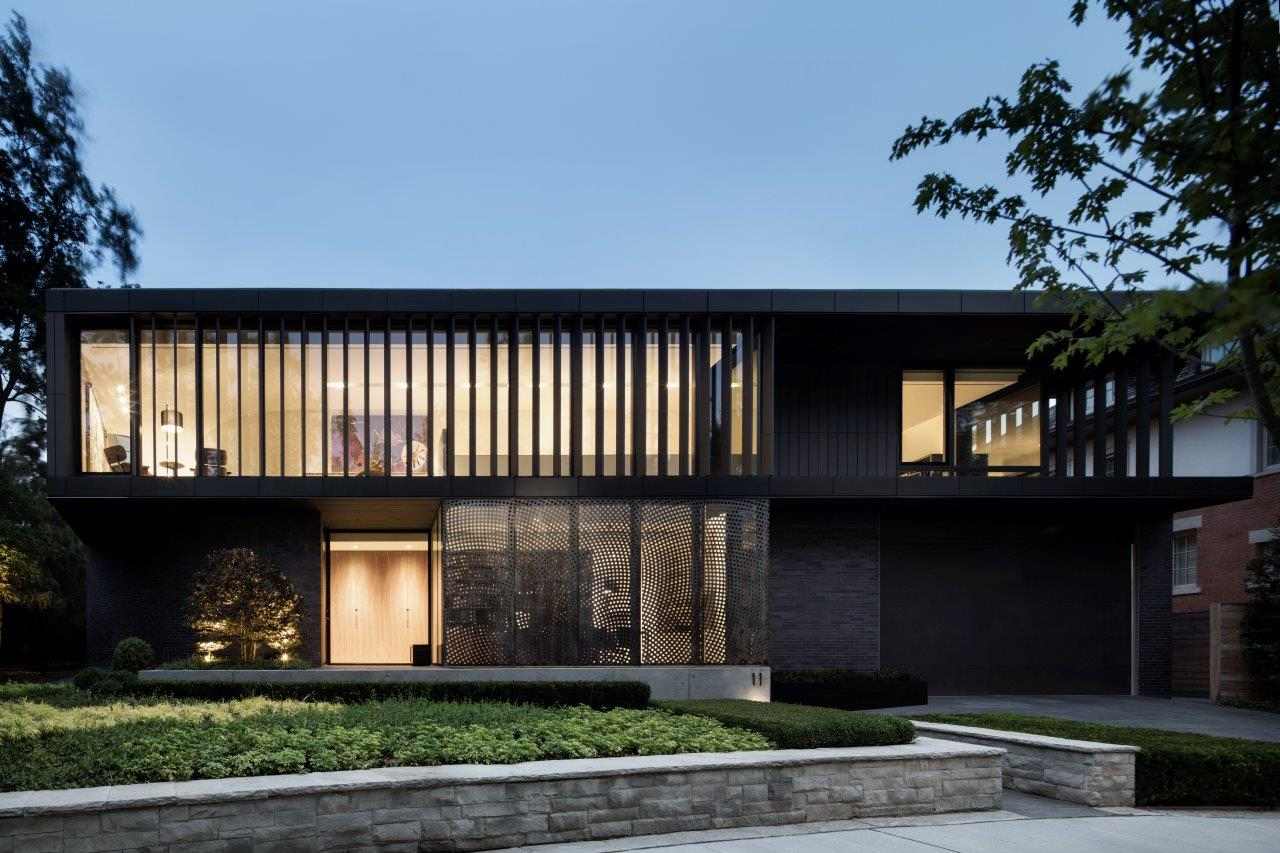Luxury custom home build front exterior with large windows